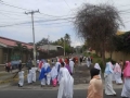 The procession starts outside of COAR, carrying the cross