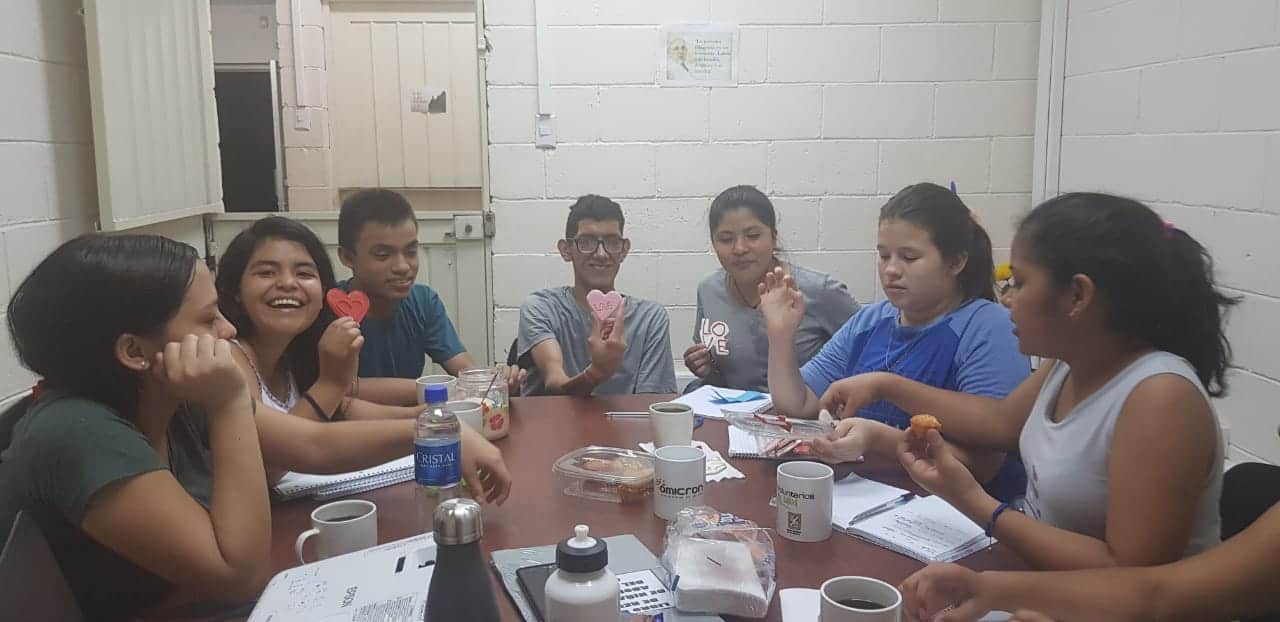 Raúl (center) and his fellow members on the COAR interno committee prepare a Valentine's Day celebration - 2020