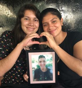 The residents hold Raul's photo as a gentle remembrance